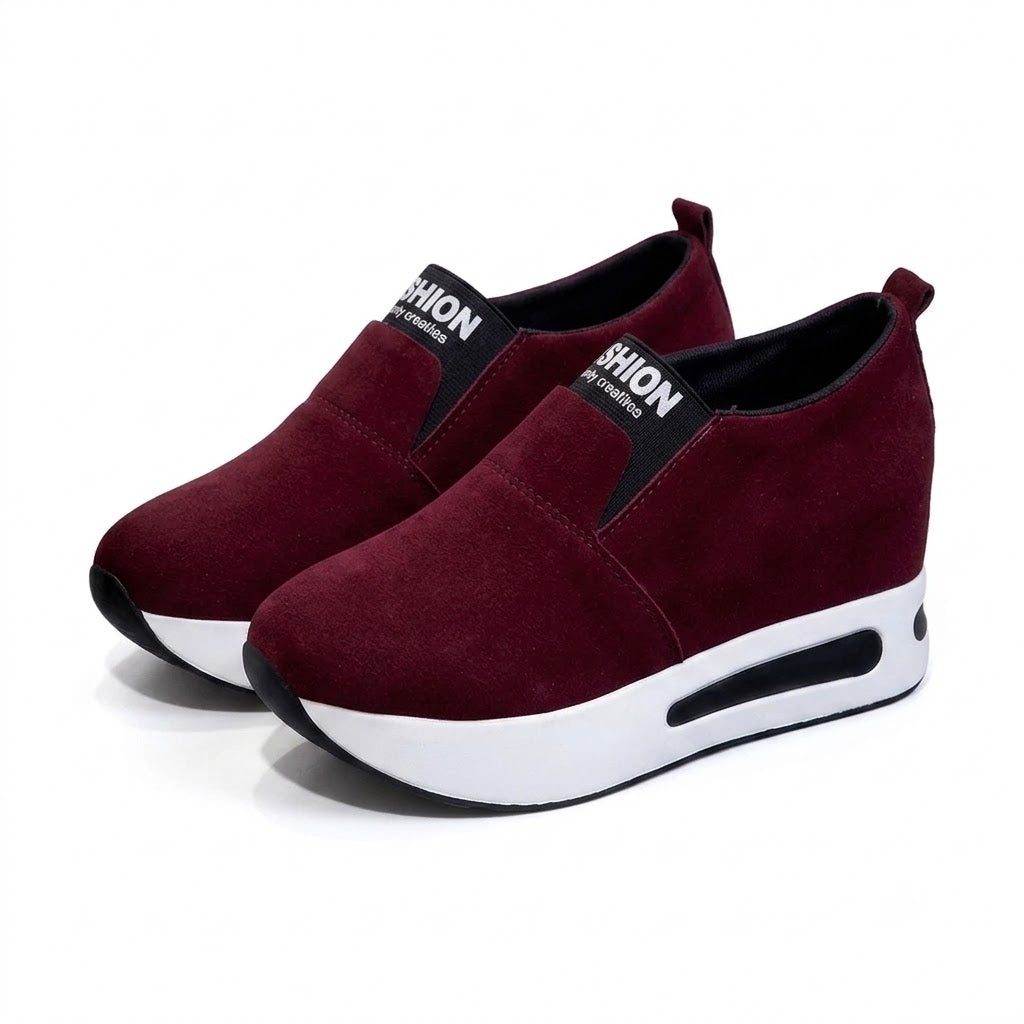 Women's burgundy platform slip-on shoes on white background