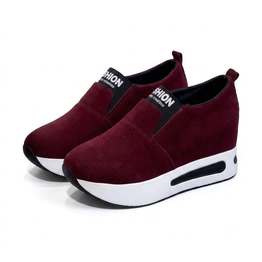 Women's burgundy platform slip-on shoes on white background