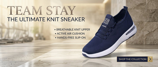 UHR Collection Premier Runner men's navy blue mesh running shoe displayed on a luxury dark navy and champagne marble platform with satin drapes and branding text