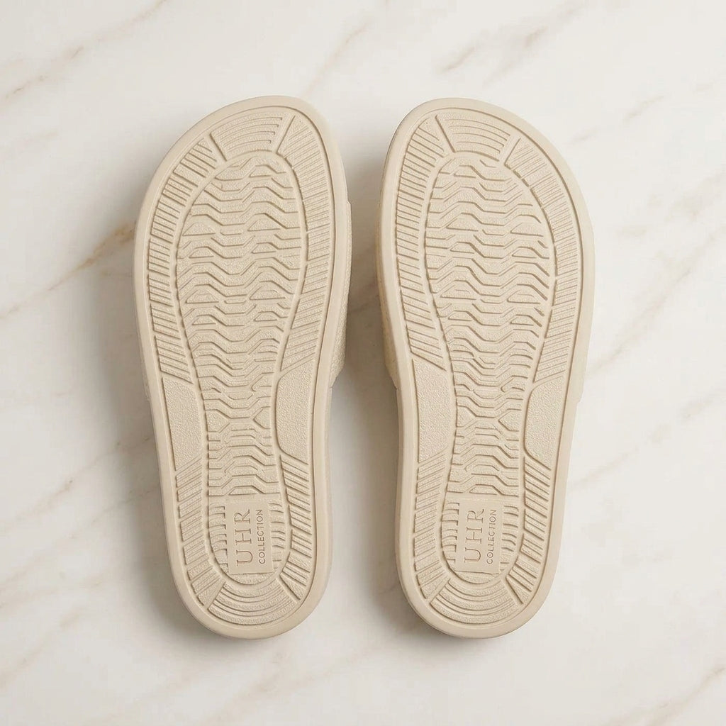 Women's cream comfort slides outsole view