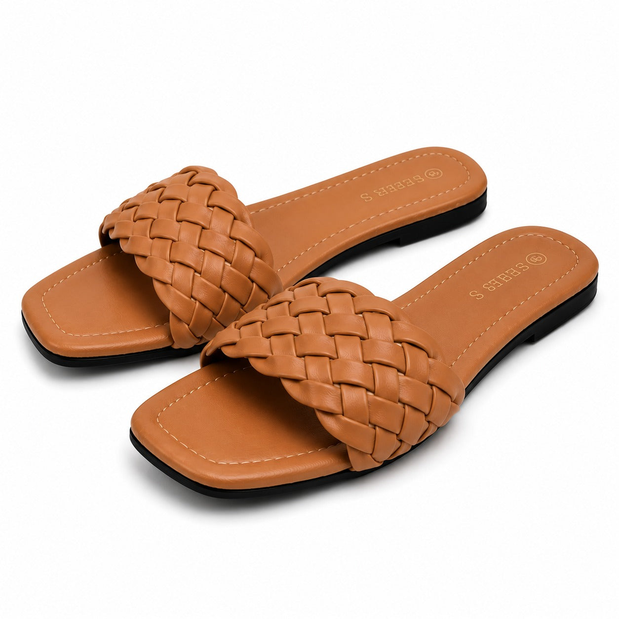 "Minimalist studio photography of a single UHR Collection women's black braided flat slide sandal, shot from a clean side profile angle on a textured beige matte surface."